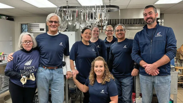 Essex Financial employees volunteering at a soup kitchen