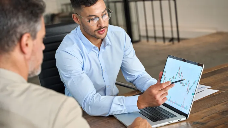 Financial advisor explaining invest stock market data consulting to investor.